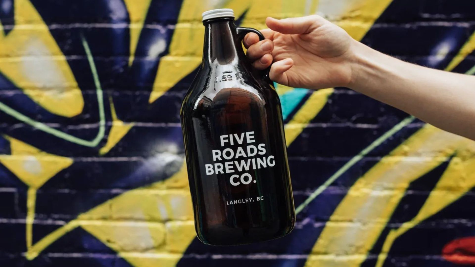 Five Roads Brewing Co. Bottle With Colorful Graffiti Background