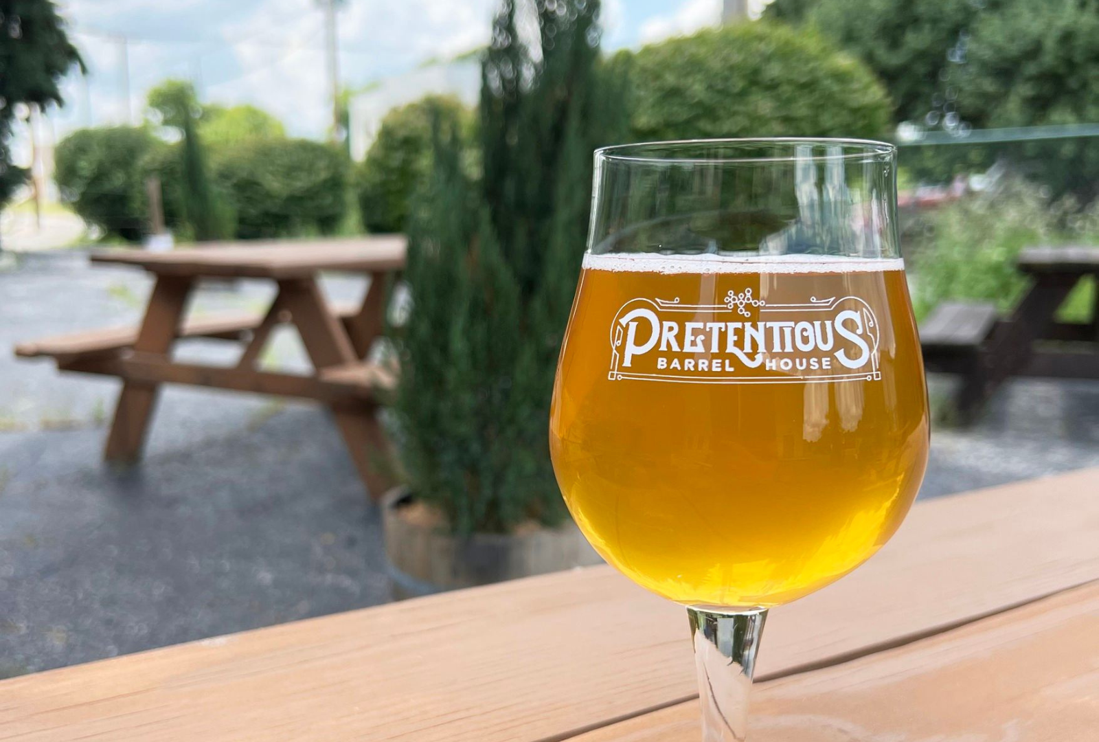 Pretentious Barrel House Beer in Glass Outdoors